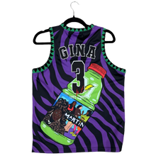 Load image into Gallery viewer, A custom printed athletic jersey laid flat on a gray carpet, featuring a purple and black zebra pattern, a green bottle graphic, and the name 'CINA' with the number '3'. A green glove and white sock are partially visible on the right side.