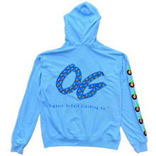 Load image into Gallery viewer, A light blue long-sleeve hooded sweatshirt laid flat on a brown carpet. The front has a large blue and yellow graphic resembling the number 50, with small text above it.