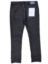 Load image into Gallery viewer, Black pants on a beige carpet
