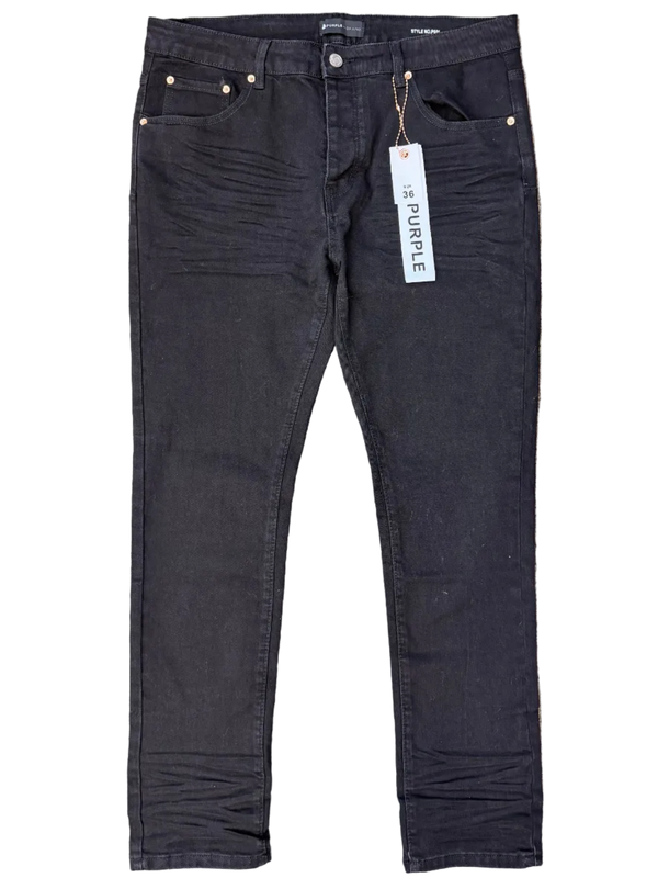 Black pants with a brand label on a gray surface