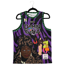 Load image into Gallery viewer, A sleeveless tank top hanging on a black hanger against a textured brown carpet background. The tank features a purple and black zebra pattern with green accents, a large illustrated portrait of a woman, and bold text reading 'DAMN GINA' and 'MGTNG'.
