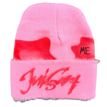 Load image into Gallery viewer, Pink beanie with red text on a textured surface
