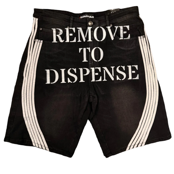 Black shorts with 'REMOVE TO DISPENSE' text on a dark background