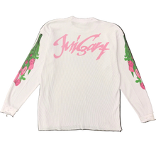Load image into Gallery viewer, White long-sleeve shirt with pink text and floral designs on a black background
